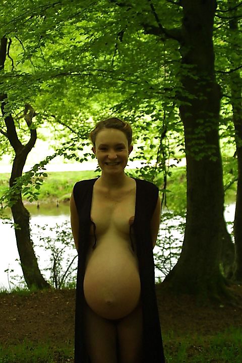 Cute pregger taking a walk in the forest #18724452