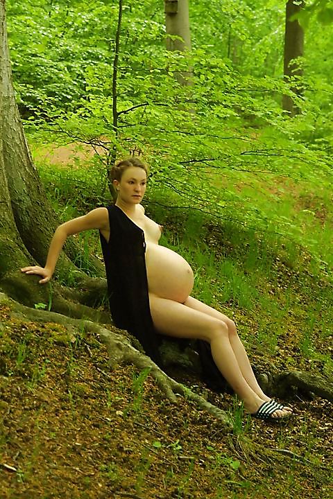 Cute pregger taking a walk in the forest #18724540