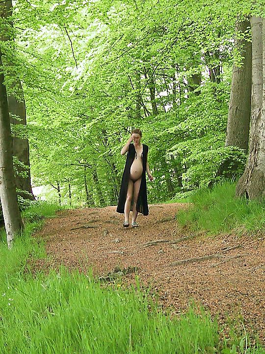 Cute pregger taking a walk in the forest #18724818