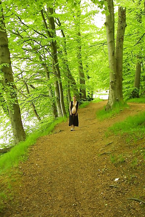 Cute pregger taking a walk in the forest #18724843