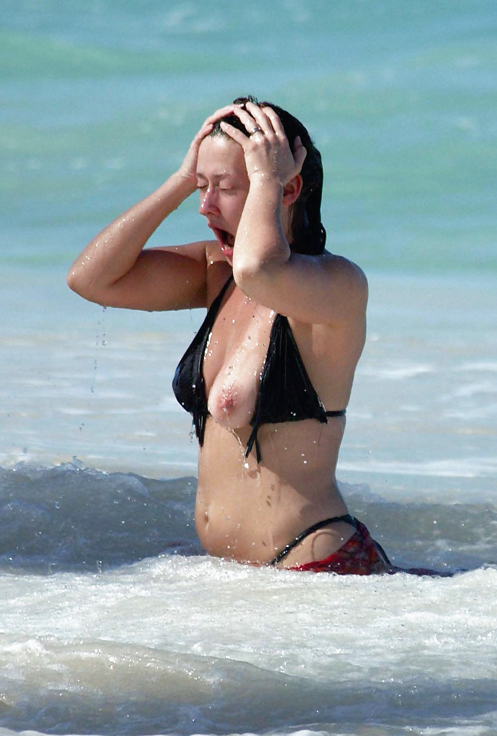 The power of waves. Bikini oops. #23886620