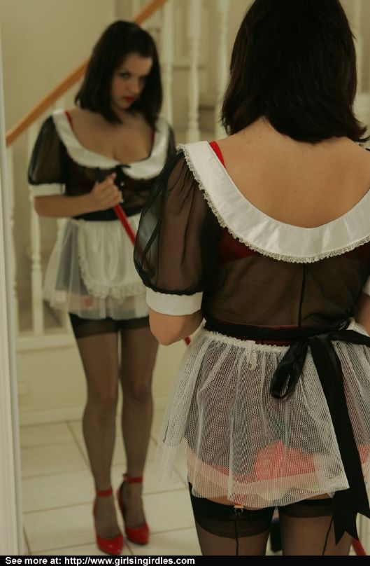 Brunette babe in stockings and maid uniform posing in front of the mirror #51291088