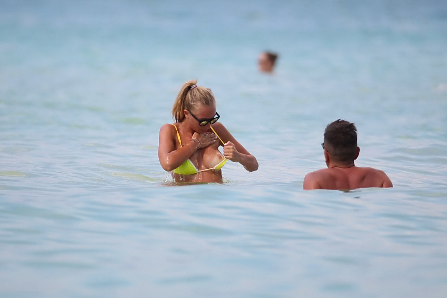 Laura Cremaschi topless and getting groped in a yellow thong bikini at a beach i #75186943