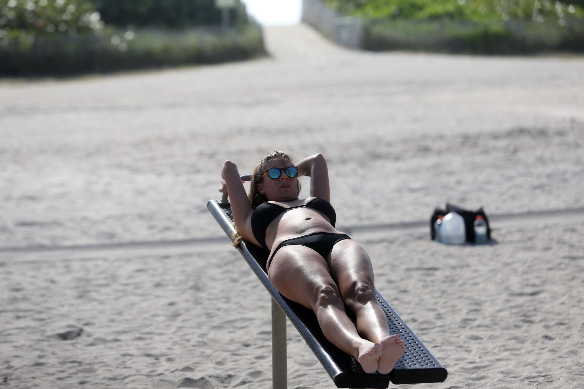 Busty Imogen Thomas works out wearing a skimpy black bikini on a beach in Miami #75170799