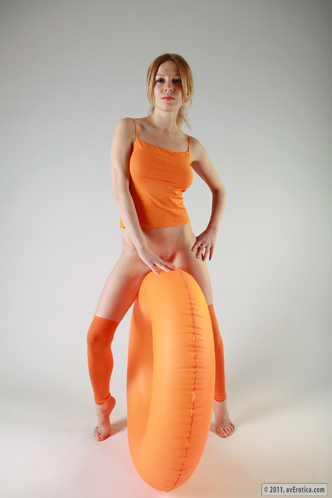 Babe in orange outfit with the orange huge balloon #78017361