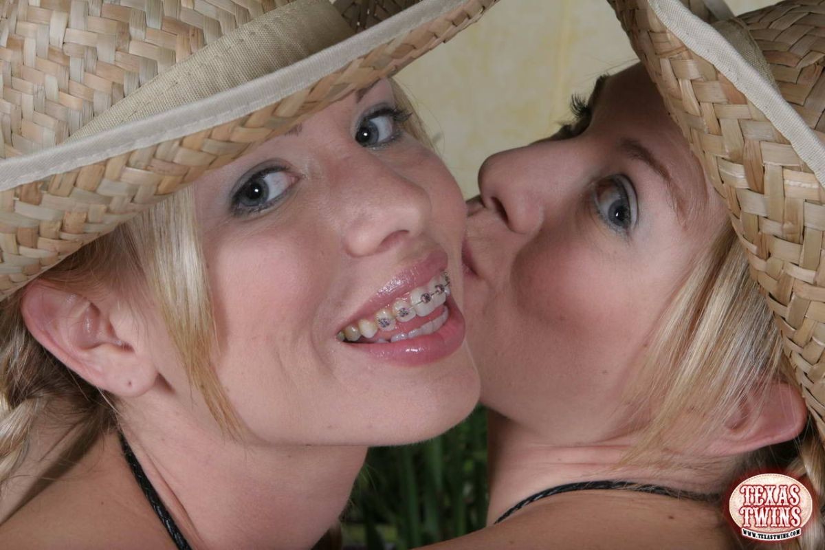 Texas twins taking top and tiny panties off to have fun on a red sofa #68462384