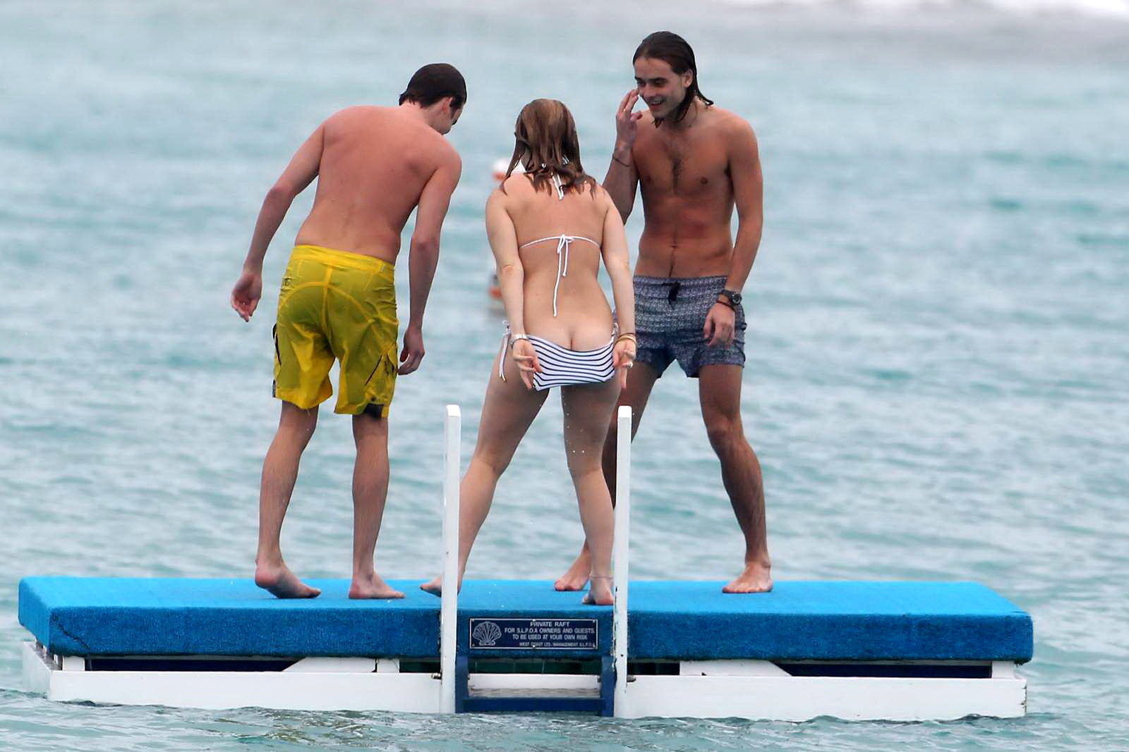 Alice Eve slipping out of her skimpy striped bikini on a beach in Barbados #75208943
