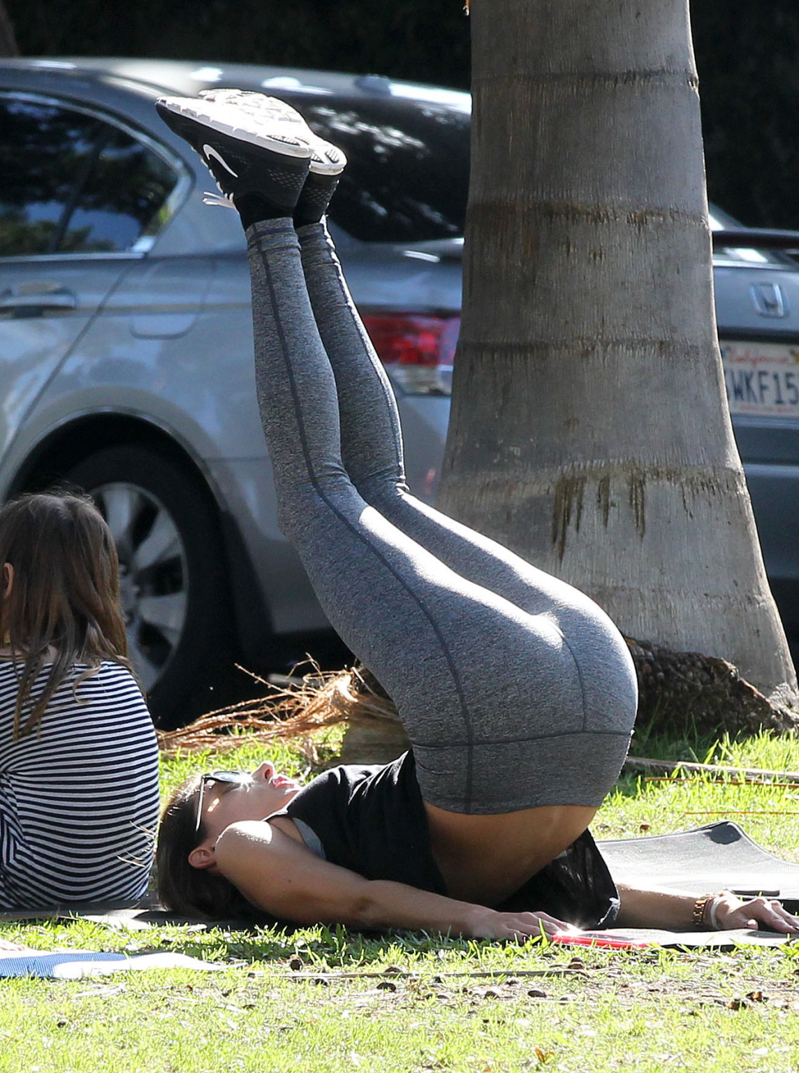 Alessandra Ambrosio shows off her ass in tights while working out at a park in S #75178937