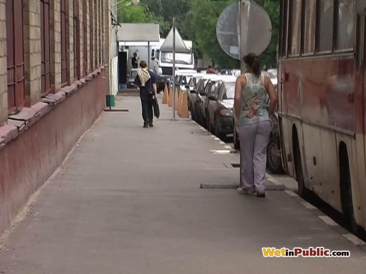 Chickie wets her white pants behind a bus as wants to pee desperately #78595251