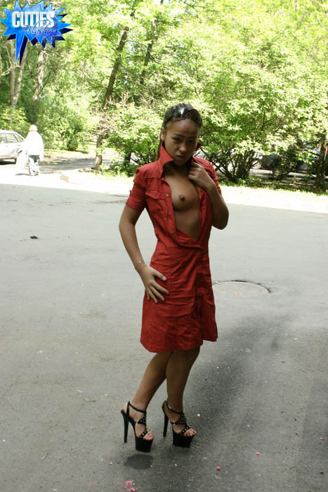 Mulatto plays with her knockers in a public place #70371505