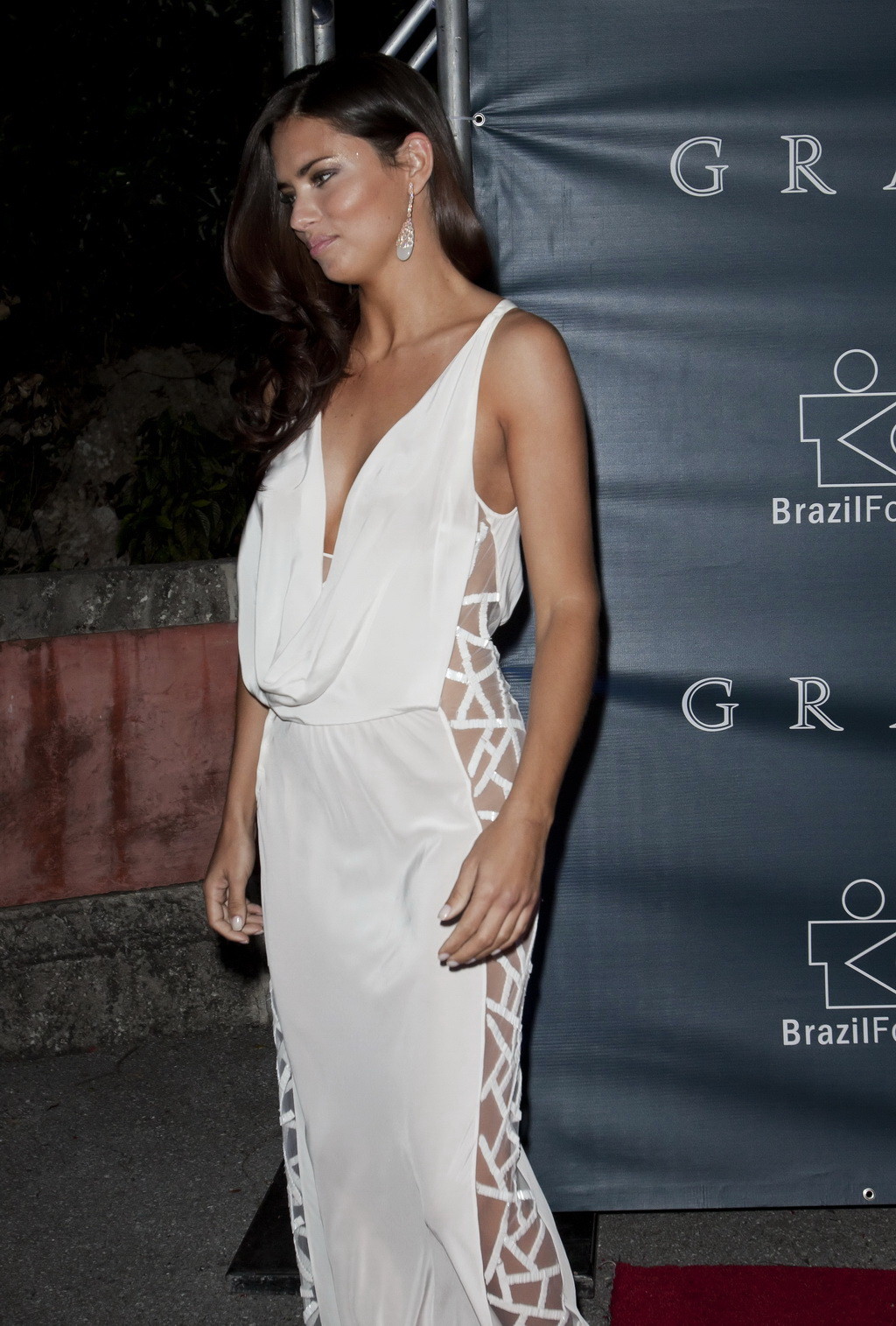 Adriana Lima braless showing huge cleavage in white partially see-thru dress at  #75237246