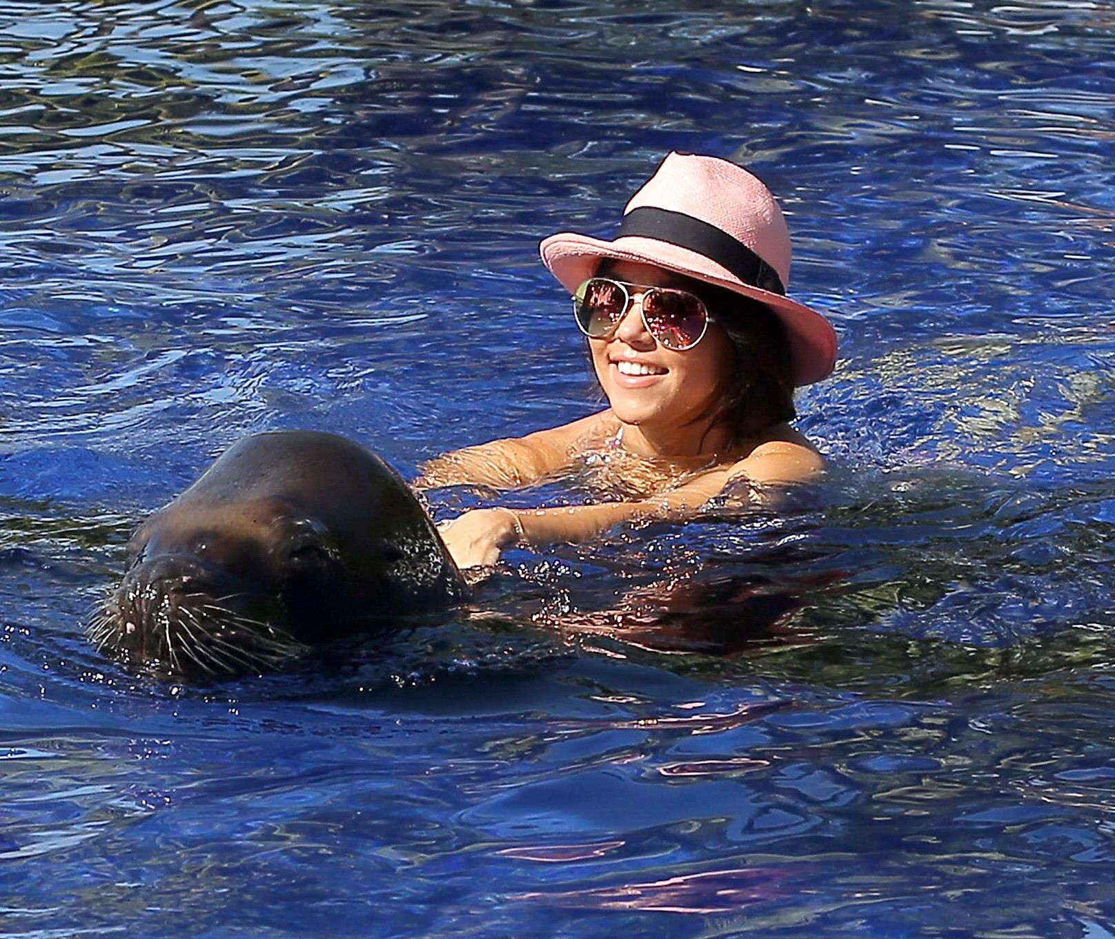 Kourtney Kardashian in bikini making out with a big seal at the pool in Mexico #75205825