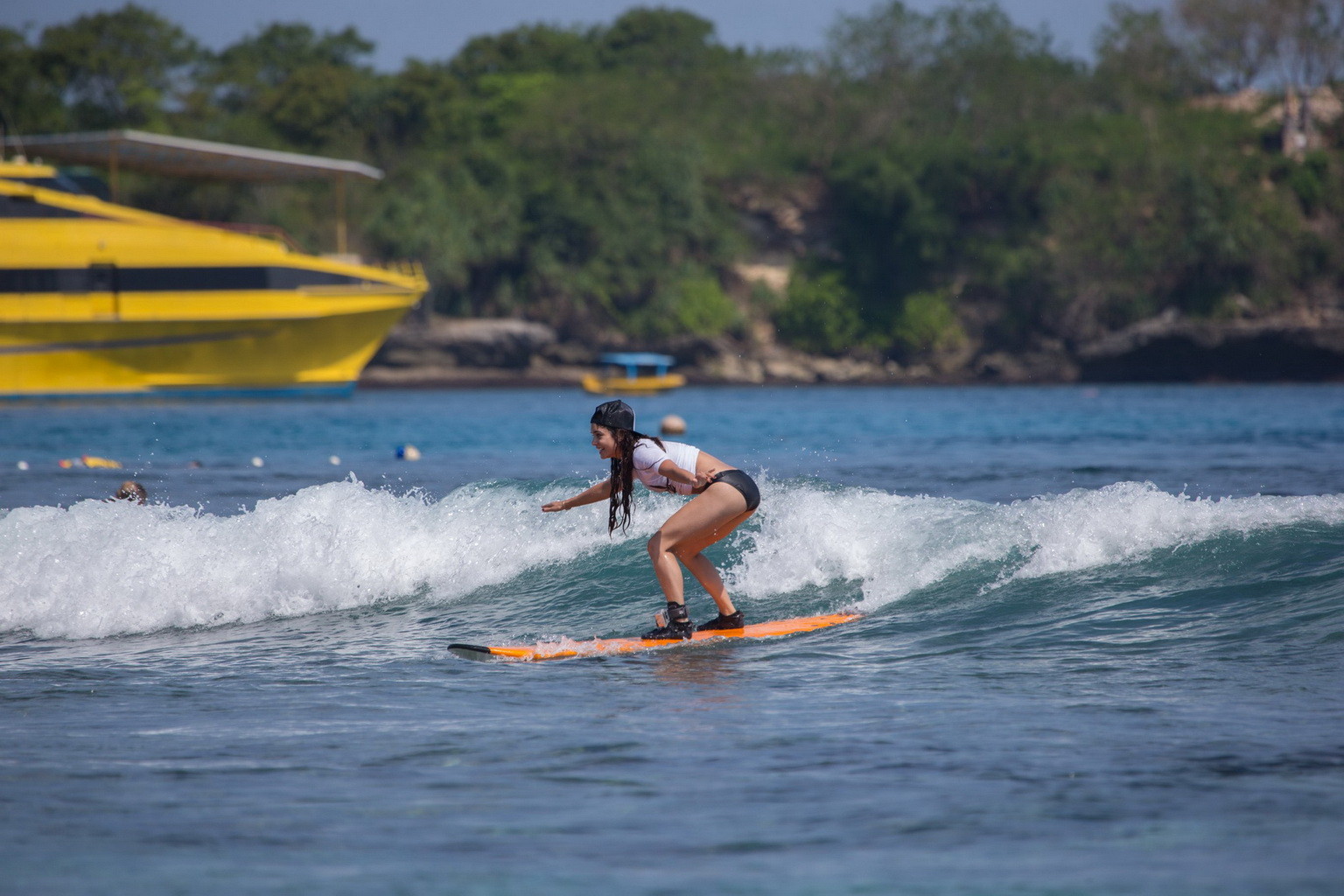 Vanessa Hudgens wearing black bikini while surfing at the Oakley Learn To Surf E #75228554