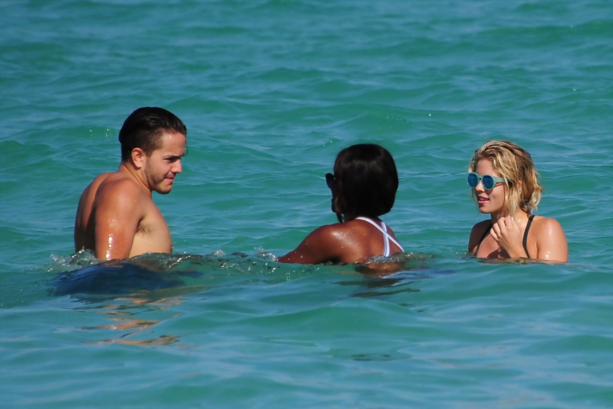 Emily Bett Rickards wearing tiny green bikini at the beach #75147979
