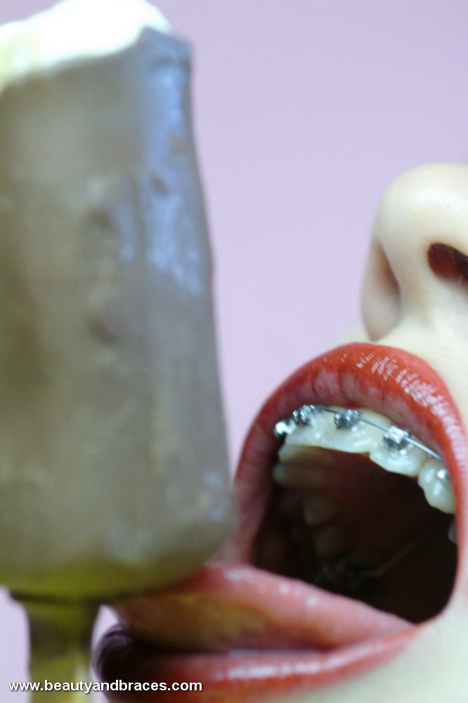 Brunette teen with braces gets messy with a popsicle #73259330