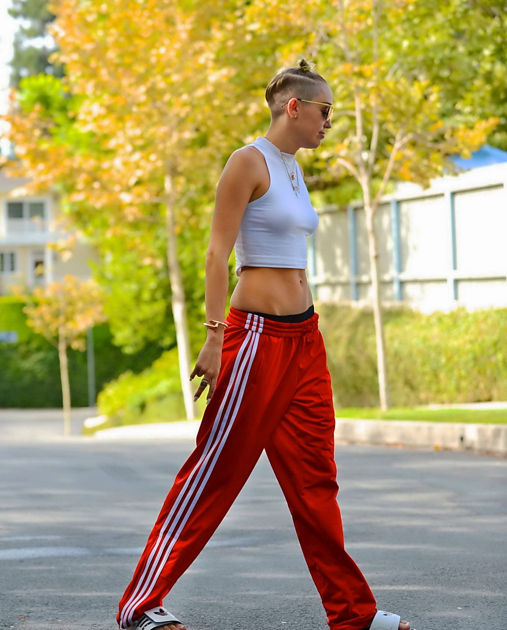 Miley Cyrus wearing white see-through belly top and red suits bottom out in Los  #75212666